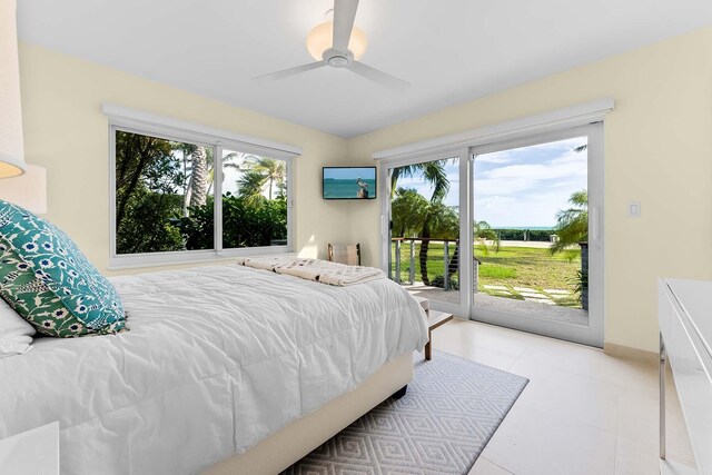 bedroom featuring ceiling fan and access to outside