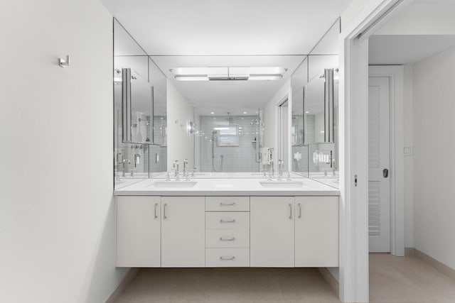 bathroom with walk in shower and vanity