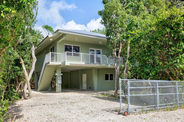 view of front facade with a carport