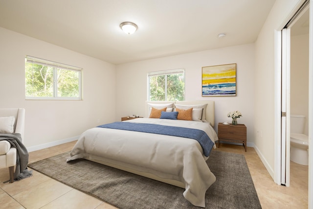 bedroom with light tile patterned flooring