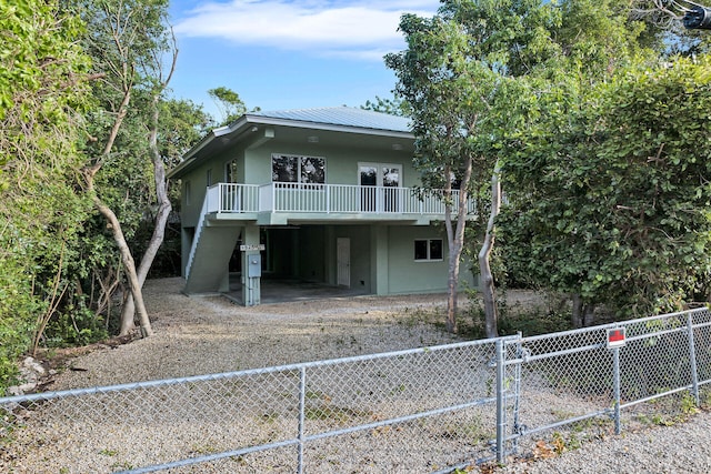 view of front of home featuring a carport