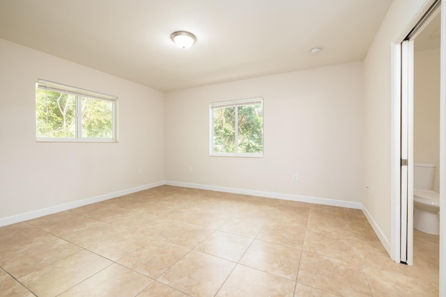 empty room with light tile patterned floors