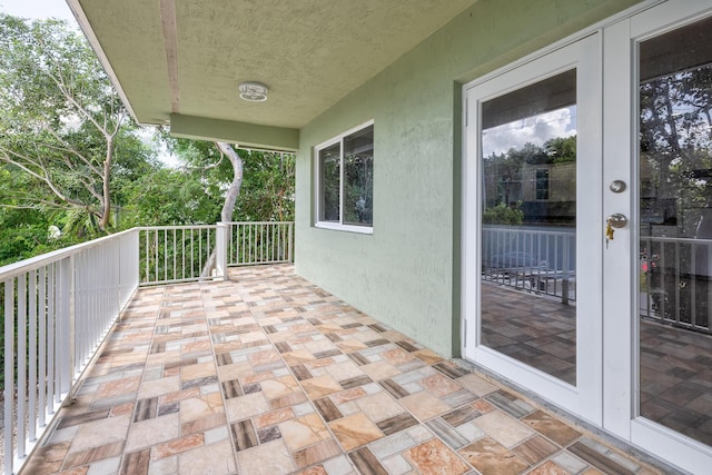 balcony featuring french doors