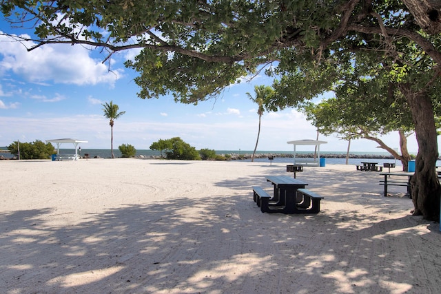 surrounding community featuring a water view