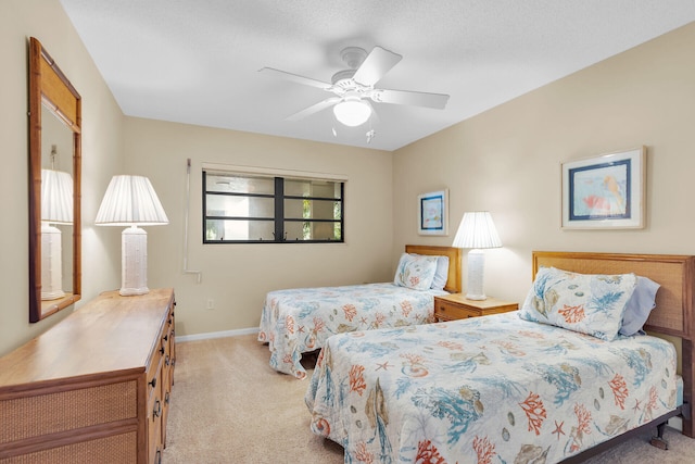 bedroom featuring light colored carpet and ceiling fan