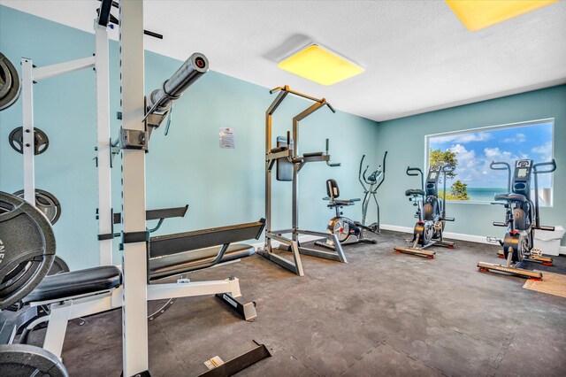 workout area featuring a textured ceiling