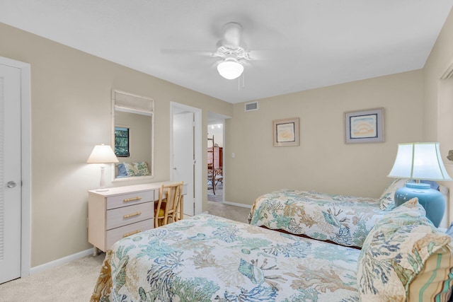 bedroom with light carpet and ceiling fan