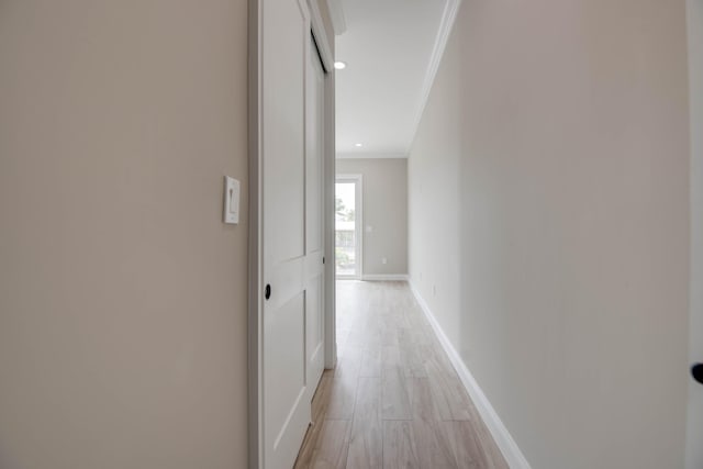 23066 Tarpon Ln, Cudjoe, FL 33042 - hallway with ornamental molding, light wood-type flooring, and baseboards