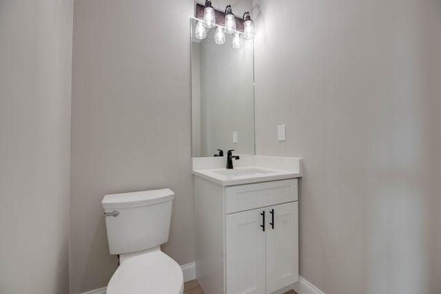 23066 Tarpon Ln, Cudjoe, FL 33042 - bathroom with toilet, vanity, and baseboards