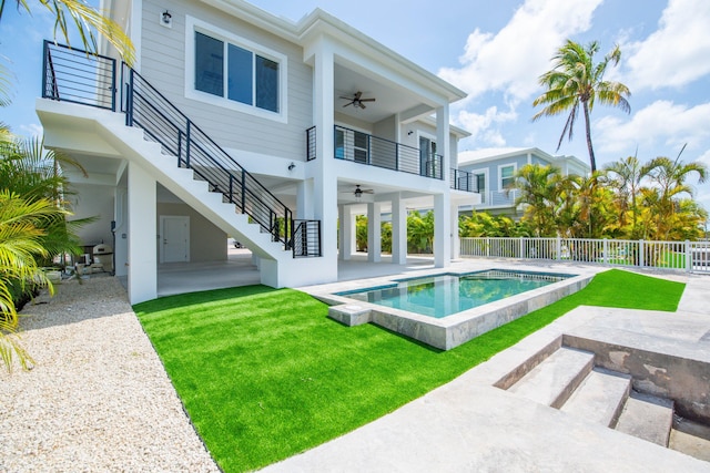 23066 Tarpon Ln, Cudjoe, FL 33042 - back of house featuring a ceiling fan, stairs, and a patio area