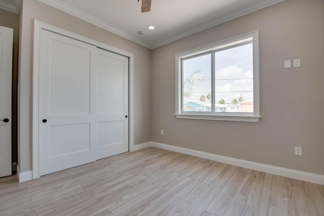 23066 Tarpon Ln, Cudjoe, FL 33042 - unfurnished bedroom featuring crown molding, a closet, light wood-type flooring, baseboards, and recessed lighting