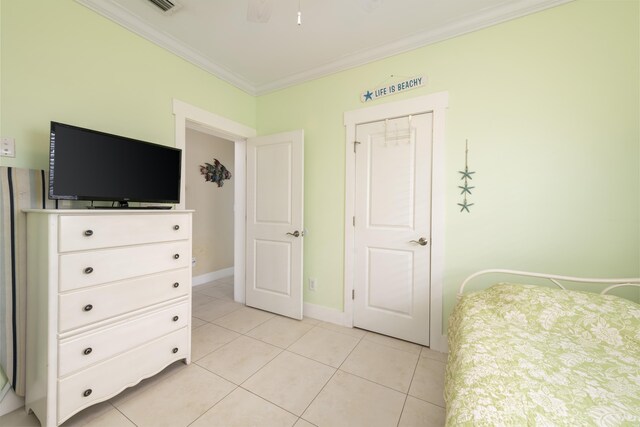 tiled bedroom with crown molding