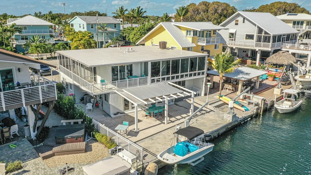 bird's eye view featuring a residential view and a water view