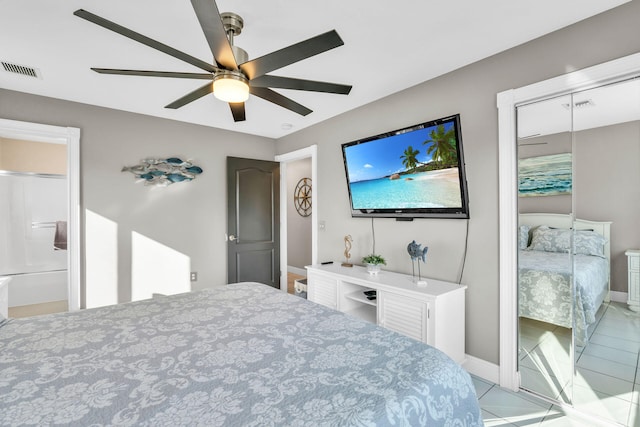 918 W Ocean Dr, Key Colony, FL 33051 - bedroom with tile patterned floors, a ceiling fan, baseboards, and a closet