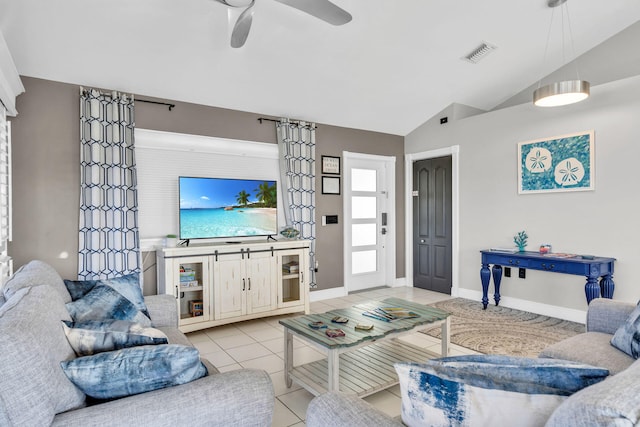 918 W Ocean Dr, Key Colony, FL 33051 - living room with lofted ceiling, a ceiling fan, light tile patterned flooring, and baseboards