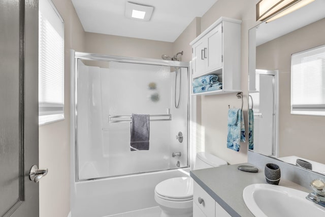 918 W Ocean Dr, Key Colony, FL 33051 - bathroom featuring healthy amount of natural light, vanity, enclosed tub / shower combo, and toilet