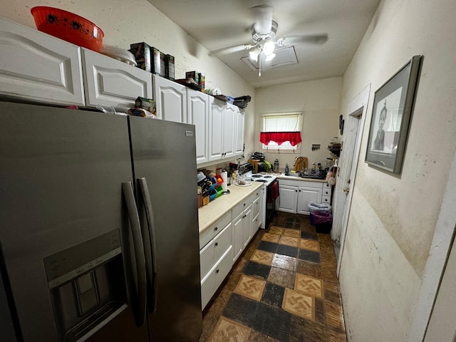 kitchen featuring sink, ceiling fan, white cabinetry, electric range, and stainless steel refrigerator with ice dispenser