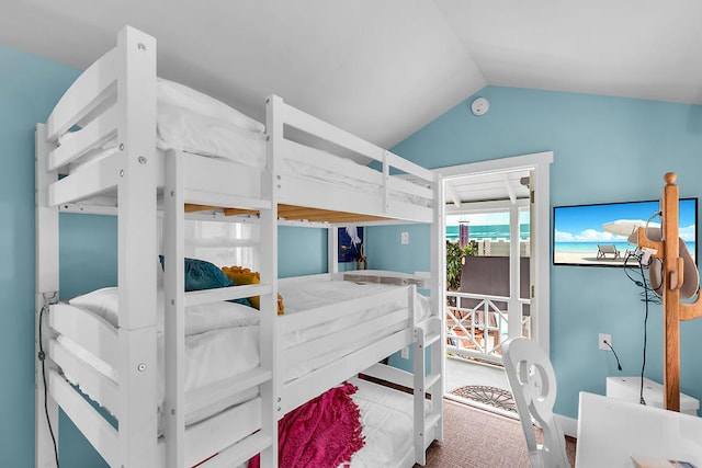 bedroom with lofted ceiling