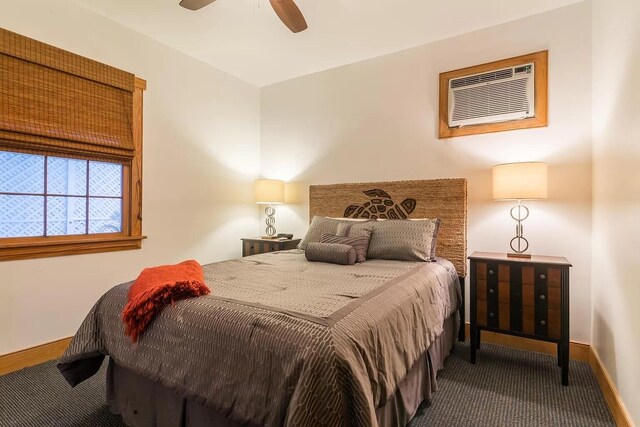 bedroom with carpet flooring, a wall mounted air conditioner, and ceiling fan