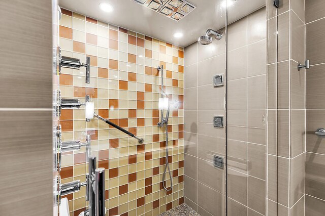 bathroom with a tile shower