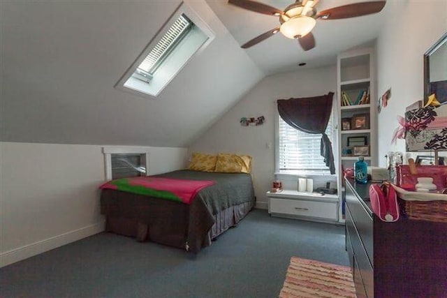 bedroom with lofted ceiling, ceiling fan, and dark colored carpet