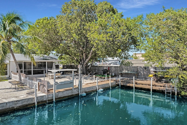 view of dock featuring a water view and a patio