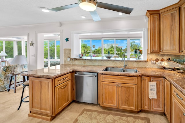 175 Galleon Rd, Islamorada, FL 33036 - kitchen with dishwasher, a ceiling fan, ornamental molding, plenty of natural light, and light stone countertops
