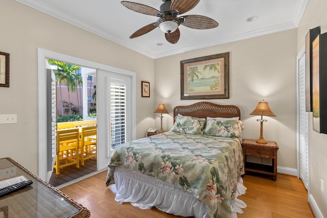 bedroom featuring ceiling fan, ornamental molding, light wood-type flooring, and baseboards