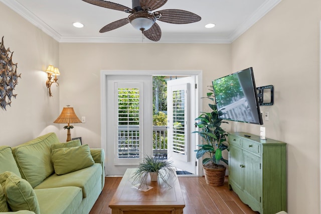 living area with ornamental molding, dark wood-style flooring, a ceiling fan, and recessed lighting