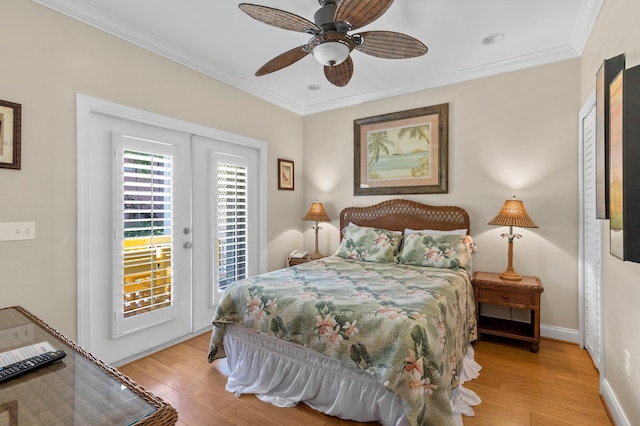 bedroom with access to exterior, light wood-style floors, ornamental molding, and baseboards