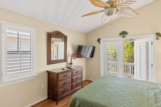 bedroom featuring lofted ceiling, a ceiling fan, baseboards, access to outside, and light wood-type flooring