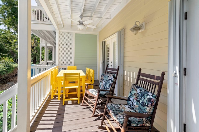 wooden deck featuring a ceiling fan