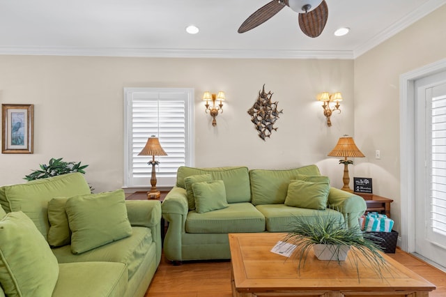 living room featuring a ceiling fan, ornamental molding, wood finished floors, and recessed lighting