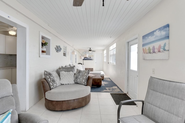 tiled living room with wood ceiling and ceiling fan