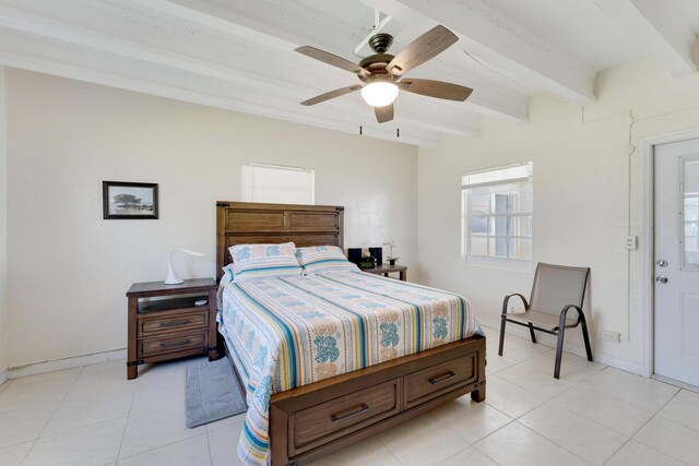 bedroom with ceiling fan, light tile patterned floors, and beam ceiling