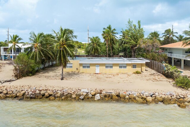 rear view of house with a water view