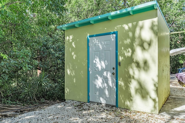 entry to storm shelter with a storage shed