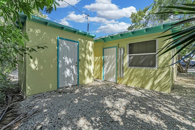 view of home's exterior featuring an outdoor structure