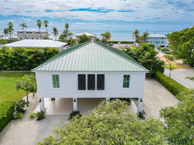 exterior space featuring a water view and a carport