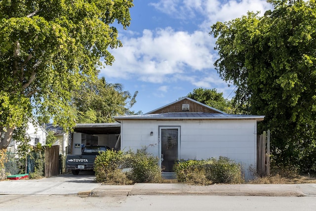 single story home featuring a carport