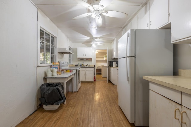 kitchen with ceiling fan, white appliances, light wood-type flooring, and white cabinets