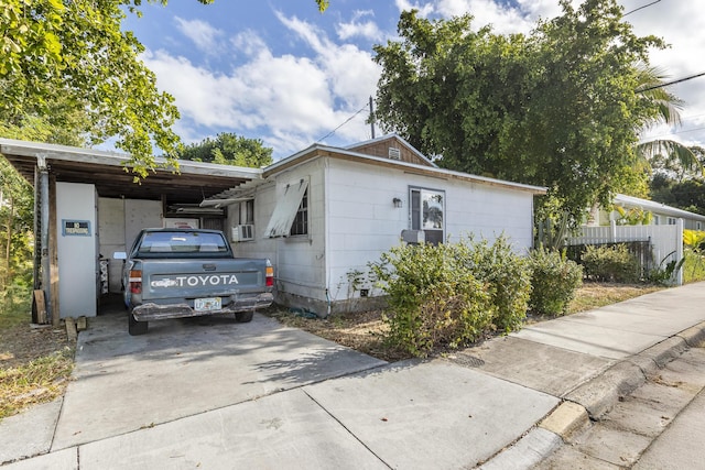 view of front of property with a carport