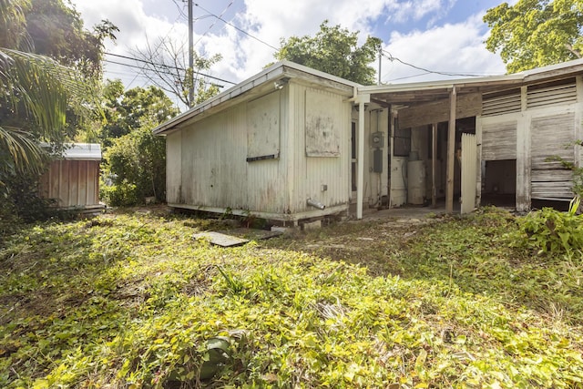 view of home's exterior with an outdoor structure