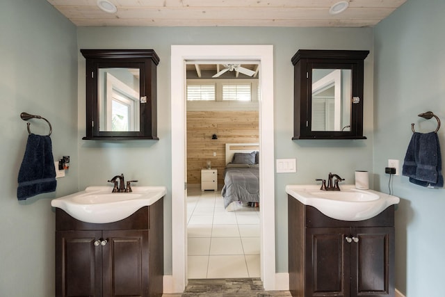 bathroom with wooden ceiling, two vanities, and a sink