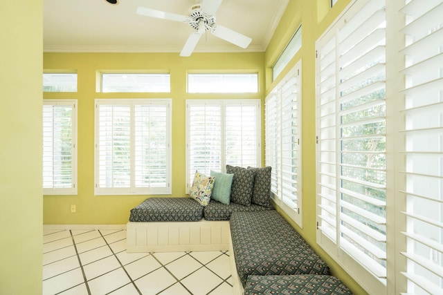 sunroom / solarium featuring ceiling fan