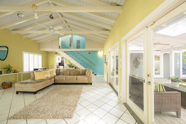 sunroom / solarium with wood ceiling, vaulted ceiling with beams, and ceiling fan