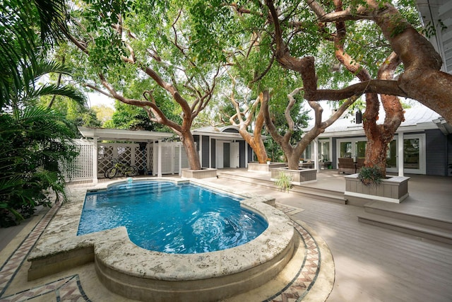 view of pool with a patio area, fence, and a fenced in pool