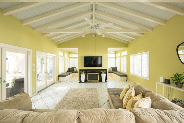 living area featuring light tile patterned floors, french doors, a fireplace, and vaulted ceiling with beams