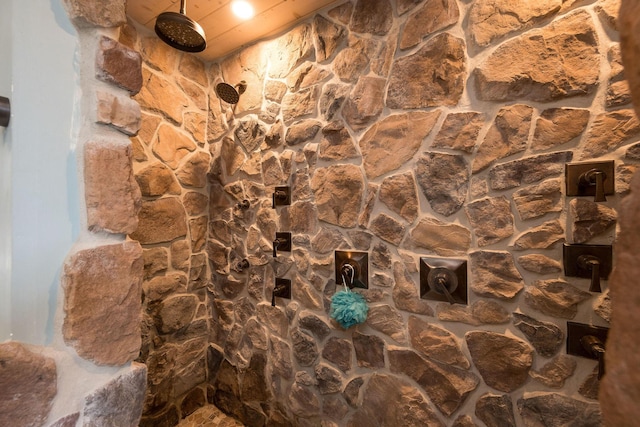 room details with a tile shower