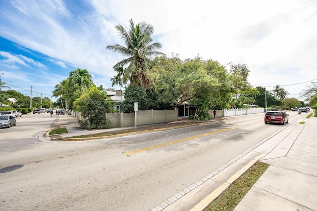 view of road with curbs and sidewalks